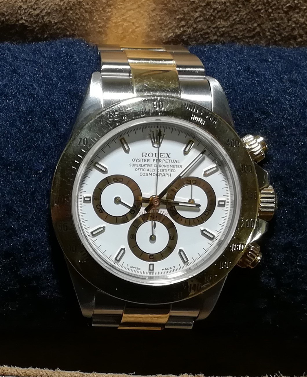 Photograph of a late-1990s Rolex Cosmograph Daytona reference 16523 in steel and yellow gold with a white dial and gold-ringed chronograph sub-dials