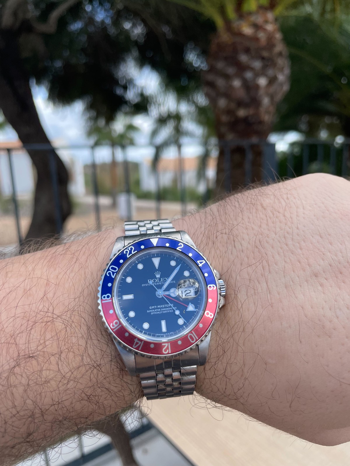 Photograph of a 1989 Rolex GMT-Master II reference 16710 with a red-and-blue Pepsi bezel and Jubilee bracelet on a wrist